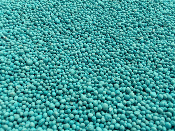 green urea fertilizer granules background. mounds of agricultural medicines to fertilize the soil and plants
